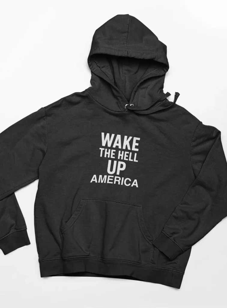 model wearing black hoodie with anti-trump design