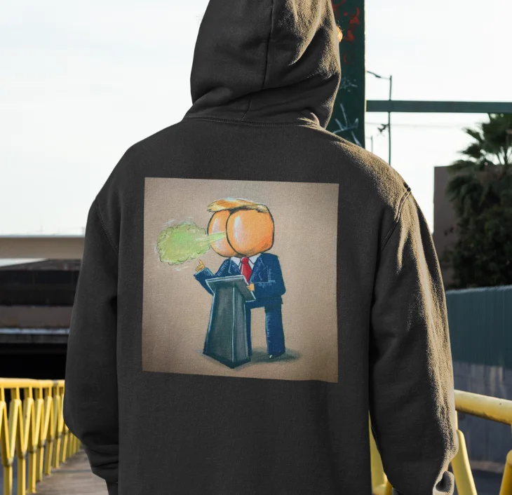 model wearing black hoodie with anti-trump design