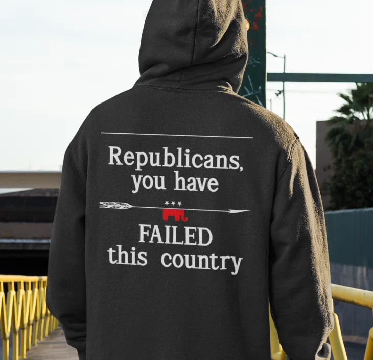 model wearing black hoodie with anti-trump design