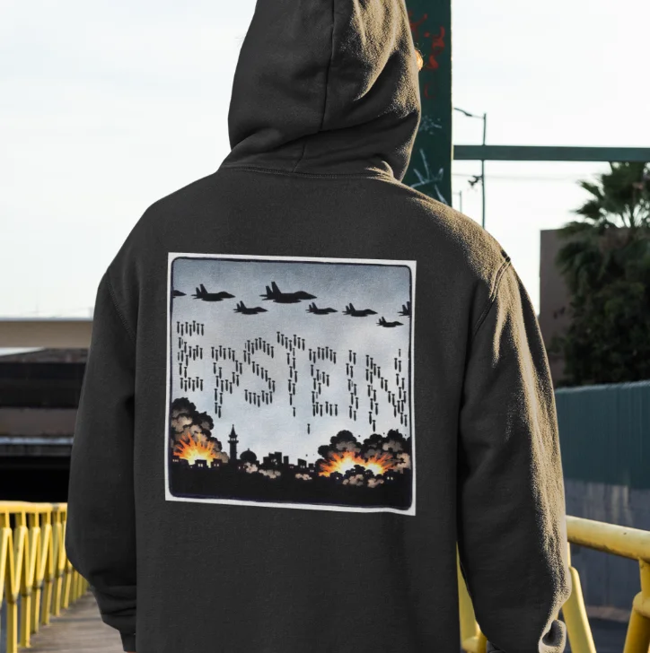 model wearing black hoodie with anti-trump design